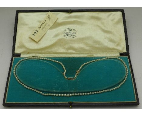 A natural pearl necklace, boxed