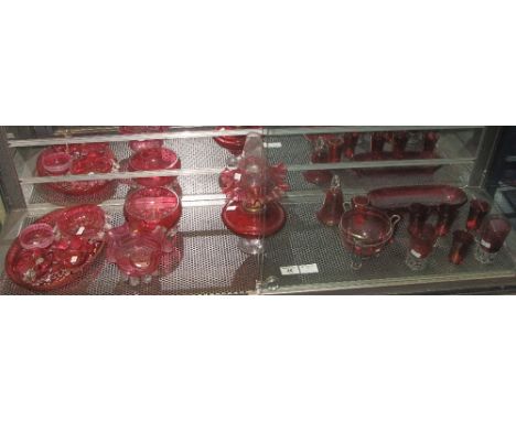 Assorted collection of cranberry glass items to include: oil lamp; dishes; oval tray; sucrier; bell; beakers etc. (19)(B.P. 2