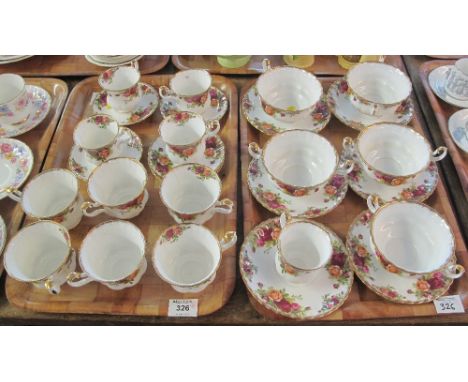 Two trays of Royal Albert bone china 'Old Country Roses' items comprising: cups and saucers and two handled bowls with saucer