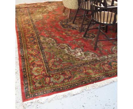 Large red ground floral and foliate carpet.(B.P. 24% incl. VAT)   CONDITION REPORT:  335 x 260cm