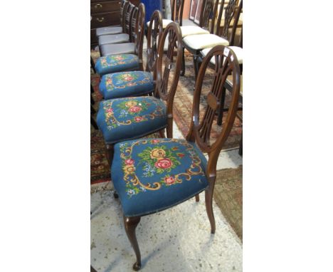 Set of four late 19th/early 20th Century mahogany inlaid, tapestry upholstered, dining chairs with oval backs on cabriole leg
