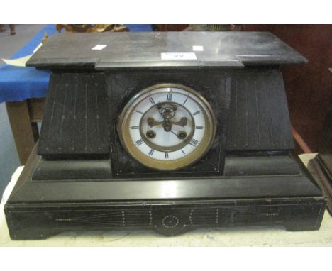 Late 19th Century black slate architectural mantel clock with two train movement, having exposed escapement and enamel dial w
