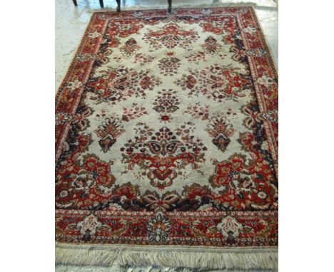 Machine made foliate carpet on a cream ground.(B.P. 24% incl. VAT)   CONDITION REPORT:  249 x 120 cm