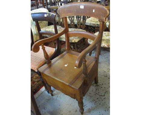 19th Century oak bar back commode armchair.(B.P. 24% incl. VAT)