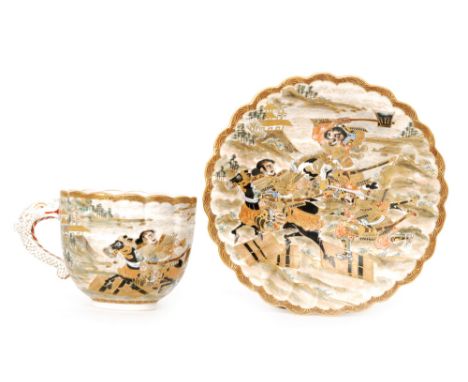 A late 19th Century Japanese Satsuma scalloped edge teacup and saucer both decorated with enamel and gilt warriors on horseba