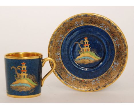 A 1920s Wiltshaw and Robinson Carlton Ware coffee can and saucer decorated with gilt and enamel Chinoiserie temple buildings 