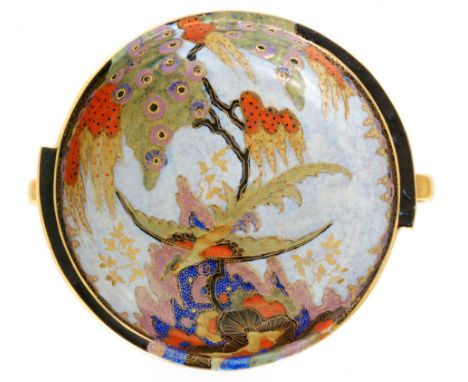 A 1930s Art Deco Crown Devon twin handled bowl with two radial fins, decorated with an enamel and gilt long winged bird amids