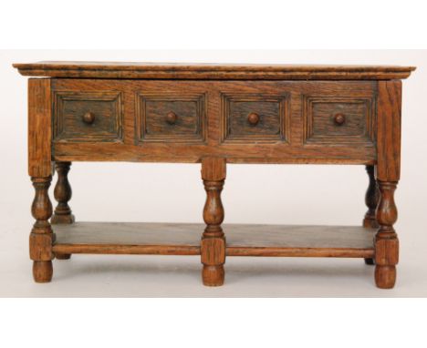 A 20th Century apprentice style miniature oak dresser with lift lid, width 24.5cm and a small 19th Century sarcophagus tea ca