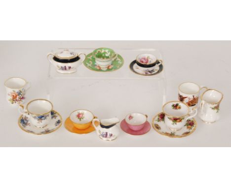 A Coalport miniature five piece tea service 'Titania', a Royal Albert miniature Old Country roses cup, sauce and cream jug, t