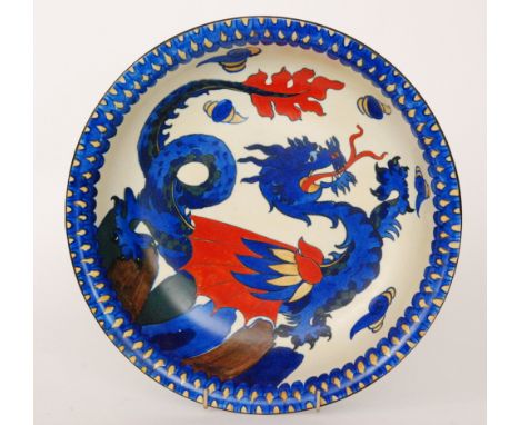 An early 20th Century Wardle Pottery bowl decorated with a blue and red dragon amidst flaming pearls with a fish scale border