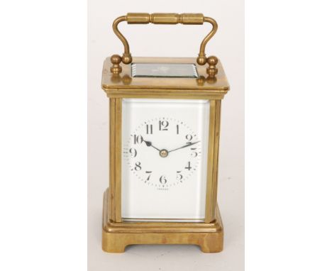An early 20th Century French brass carriage clock with white enamelled Arabic dial striking on a gong retailed by Bailey Bank