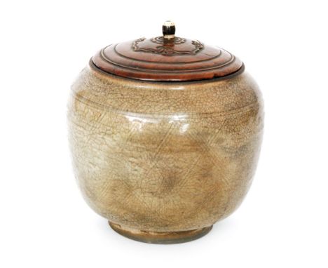 A Chinese Ming Dynasty Song style Ge type jar of footed swollen ovoid form decorated with fine cross hatch lines beneath a de