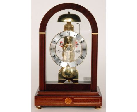 A late 20th Century skeleton mantle clock by Sewills, from the Admiralty Arch Collection, in a mahogany veneered case over br