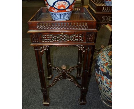A pair of reproduction mahogany fretwork occasional tables in the Chinese Chippendale style, each with a galleried top above 