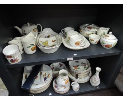 Two shelves of Royal Worcester Evesham and similar table wares 