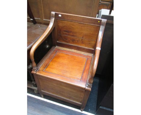 A late Victorian mahogany commode/throne armchair, having box base