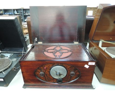 A vintage wireless in wooden case, having bakelite knobs (sold as untested collectors item)