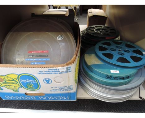 A collection of vintage film reels and cans