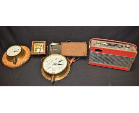 A novelty reproduction brass pocket sun dial with compass, Dolland London, mahogany glazed case; a Roberts transistor radio; 