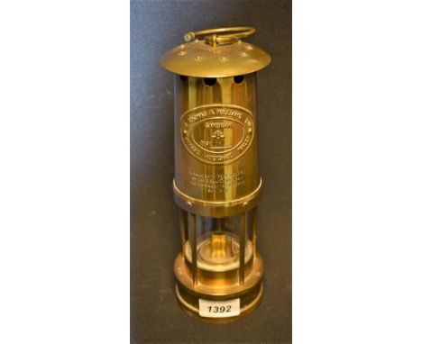 A brass miner's lamp, E Thomas and Williams, Cambrian, presented for service to the Industry Nov. 1986