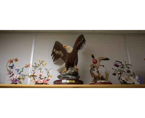 A set of three Franklin Mint House of Faberge limited edition tropical bird models, The Enriched Garden, 2176/9500, certifica