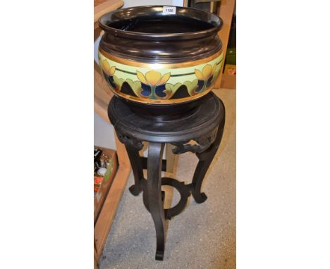 A Bretby Art Pottery jardiniere, on Chinese stand