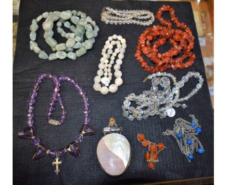 Jewellery - a free form red stone bead necklace and bracelet suite;  an amethyst glass bead necklace;  a chatoyant quartz gra