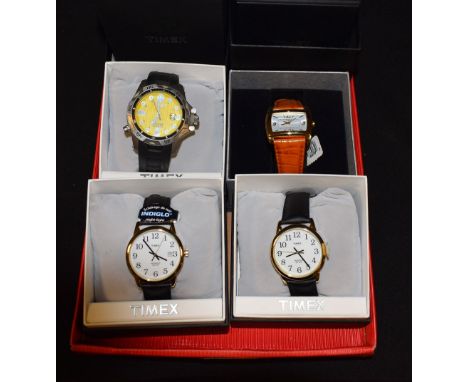 Watches - Timex, a Titanium WR200M wristwatch, yellow dial, luminous baton markers, arrow hands, black rubber strap; others W