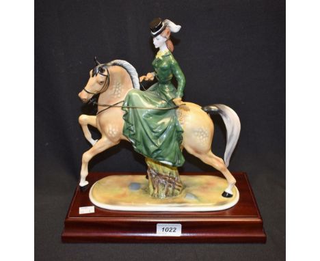 A Coalport ceramic figure of a female on horseback, La Promenade a Cheval, modelled by Donald Brindley, limited edition 18/10