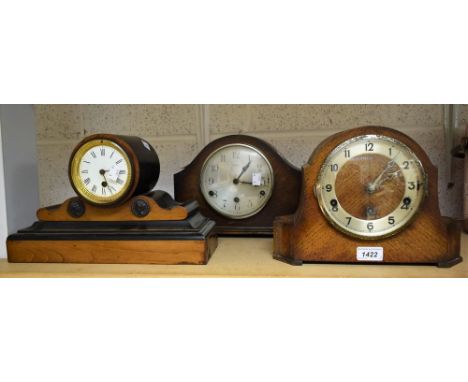 A Victorian ebonised mahogany drumhead mantel clock, Roman numerals on white dial; a 1930's oak mantel clock; another similar