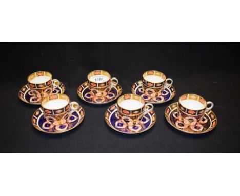 A set of six Royal Crown Derby 1128 pattern coffee cups and saucers