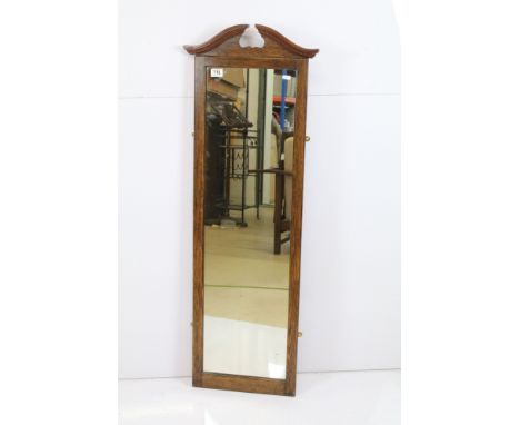 20th Century stained oak rectangular wall mirror, with carved swan pediment, measures 125cm x 37cm