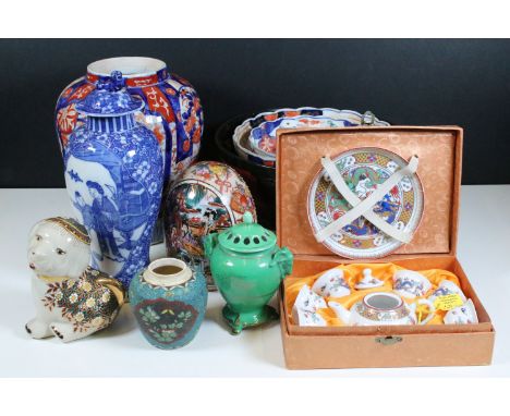 Collection of Oriental ceramics to include Imari ware vase, H23 cm, plates and bowls, red and black lotus bowl, 25cm diameter