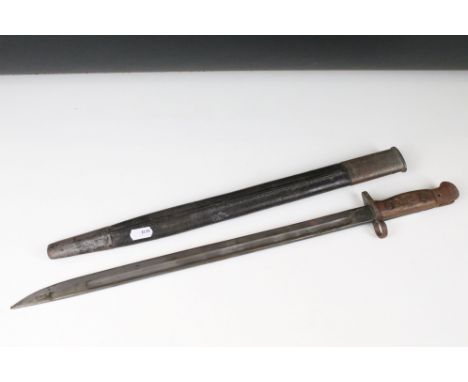 A British World War One 1907 pattern Lee Enfield bayonet complete with leather scabbard. 