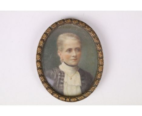 Late 19th century English School, head and shoulders oval portrait miniature depicting a lady, watercolour, 6.5 x 5.5cm, gilt