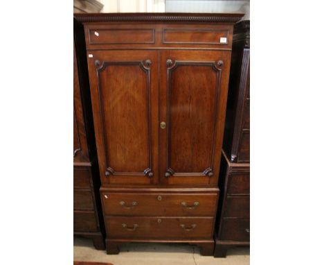 Georgian mahogany double door wardrobe with carved flower detail, two lower drawers, raised on bracket feet, H 196cm, W 102cm