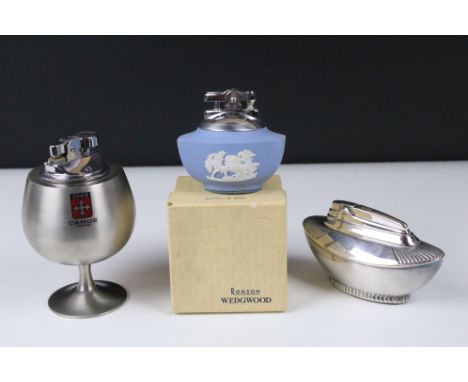 A collection of three vintage table lighters to include Ronson and Wedgwood examples. 