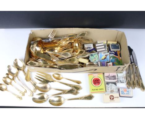 A quantity of Solingen gold plated cutlery together with a selection of matchboxes and erotic playing cards. 