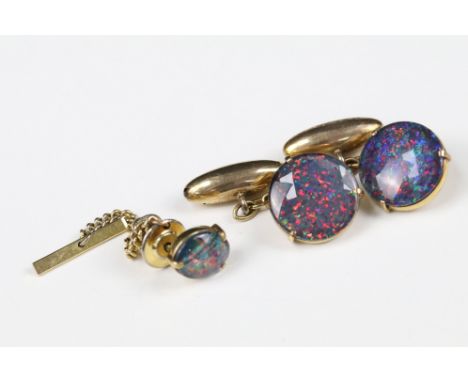 A pair of 9ct gold and black opal cufflinks together with matching tie pin. 