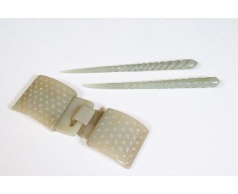 Chinese jade belt buckle with raised spotty design, 11cm long and a pair of Chinese jade twisted hair sticks / hairpins, each