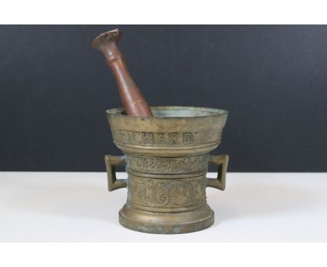 Cast brass pestle and mortar with bust of a man amongst bands of flowers and band of typography 'Richard Startyn 1623' 