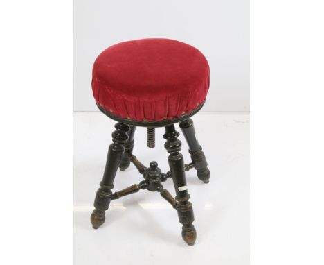 Victorian mahogany adjustable circular red velvet upholstered piano stool on four turned legs with X support stretcher, H 50c