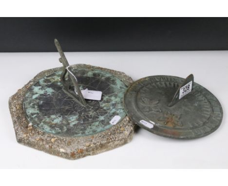 A vintage cast metal sundial with decorative butterfly decoration together with a second example mounted to stone base. 