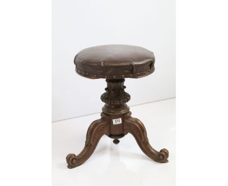 Victorian mahogany circular brown leather upholstered piano stool on turned support and tripod base 