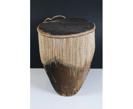 Small African tribal ceremonial cowhide drum, with carry handle, measures 35cm tall