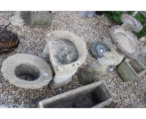 Reconstituted stone cherub based bird bath together with a winged lion detail seat and an oval basket style planter (3) 