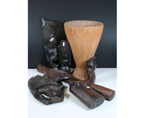 Collection of hardwood tribal collectables to include large wooden mortar, carved figures, carved African tribal masks, etc