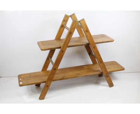 Vintage style pine display unit comprising two plank shelves held on a folding ladder type frame, 106cm high x 152cm long