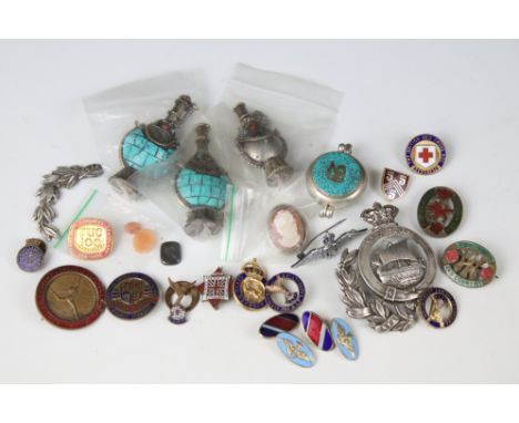 A small group of mixed collectables to include enamel badges and white metal oriental bottles. 