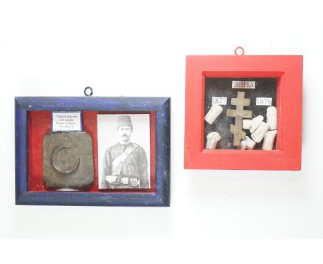 A framed and glazed Turkish Infantry belt buckle, Russo-Turkish war 1877/78 together with a a framed and glazed group of Russ